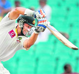 Mike Hussey hits a drive in Sydney on Wednesday
