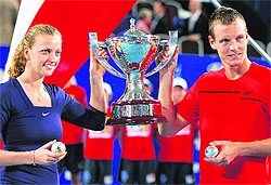 Tomas Berdych (R) and Petra Kvitova of the Czech Republic celebrate clutching diamond encrusted tennis balls and the Hopman Cup in Perth on Saturday
