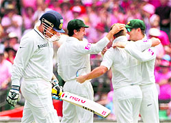 Virender Sehwag (left) returns dejected to the pavilion after playing another rash shot