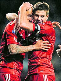 Liverpool's Jonjo Shelvey (L) celebrates with Steven Gerrard after scoring during the FA Cup against Oldham Athletic in Liverpool on Friday
