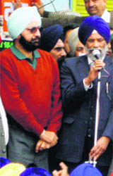 Malvinder Singh with SAD candidate Surjit Singh Rakhra in Samana on Sunday. 