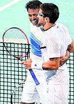Leander Paes celebrates with partner Janko Tipsarevic after winning the doubles semifinal match of the Chennai Open on Saturday