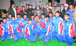 Rurka FA players pose with their trophy after winning the Edu Football League on Monday.