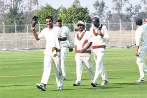 Haryana�s Harshal Patel (8-34) leaves the field after Rajasthan�s innings in Rohtak on Tuesday. 