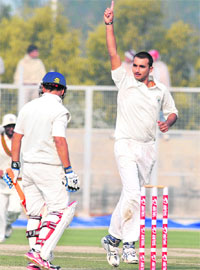Haryana�s Harshal Patel celebrates a wicket.