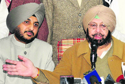 Amarinder Singh with Sehajdhari Sikh Party chief PS Ranu (L) in Chandigarh.