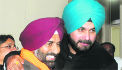 Pargat Singh with Navjot Sidhu after filing his papers.