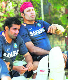 VVS Laxman (R) and Gautam Gambhir during a practice session ahead of the third Test match in Perth on Thursday. 