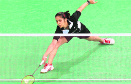 Saina Nehwal hits a return to Wang Yihan in the semifinals of the Malaysia Open badminton tournament in Kuala Lumpur on Saturday.