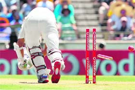 Knocked out: Rahul Dravid is dismissed by Ryan Harris on Day Three of the third Test in Perth on Sunday