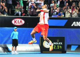 Jo-Wilfried Tsonga celebrates defeating Denis Istomin at the Australian Open in Melbourne on Tuesday