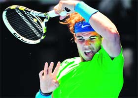 Rafael Nadal hits a return against Tommy Haas in their second round match in Melbourne on Wednesday