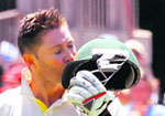 Michael Clarke kisses his helmet after completing his double century during the fourth Test in Adelaide on Wednesday