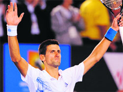 Novak Djokovic celebrates after beating David Ferrer at the Australian Open in Melbourne on Wednesday