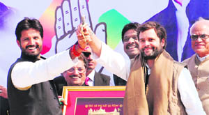 Rahul Gandhi and Congress's Gidderbaha candidate Amarinder Singh Warring 'Raja' at an election rally in Doda. 