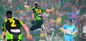 Brett Lee (C) jumps in celebration after dismissing Virender Sehwag in Sydney on Wednesday. 