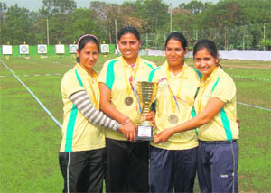Punjab team comprising of archers Priyanka, Amandeep Kaur, Satbir Kaur and Komalpreet Kaur pose with their trophy. 