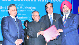 Chief Commissioner of Customs and Central Excise and Service Tax in Chandigarh, PS Pruthi, receives the World Customs Organisation Certificate of Merit from Finance Minister Pranab Mukherjee on the occasion of International Customs Day in New Delhi.