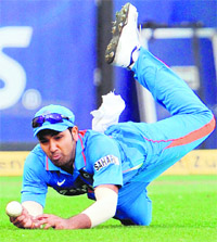 Rohit Sharma dives and drops a catch of Australian batsman David Hussey in their ODI match in Melbourne on Sunday. 