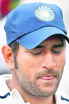 Close eye on things: Captain MS Dhoni (pic) needs to sort out his differences with Virender Sehwag. 