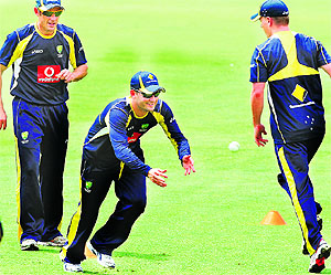 Australian captain Michael Clarke (C) practices with teammates at the WACA ground in Perth on Thursday