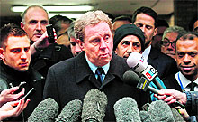 Manager of Tottenham Hotspur Harry Redknapp (C) addresses the media in London on Thursday