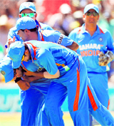 Indian players congratulate teammate Rohit Sharma for running out Australia's David Warner in the ODI in Adelaide on Sunday. India won that match by 4 wickets.