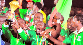 Zambia's national football team players celebrate with the trophy after their victory over Ivory Coast in the Africa Cup of Nations final match in Libreville on Monday. Zambia won 8-7 in a penalty shoot-out.