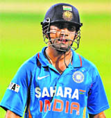 Gautam Gambhir leaves the field after being run-out for 91 against Sri Lanka in Adelaide on Tuesday. 