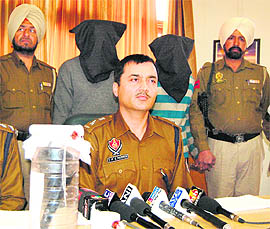 SPS Parmar, SSP, shows the weapon seized from the accused.
