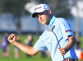 Bill Haas of the United States celebrates after making a birdie putt on the second playoff hole during the final round of the Northern Trust Open golf tournament at Riviera Country Club in Los Angeles on Monday.