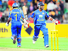 Sri Lanka�s Nuwan Kulasekara (R) celebrates hitting the winning runs against Australia with teammate Thisara Perera (L) in Hobart on Friday. Sri Lanka won the match by three wickets. 