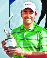 Anirban Lahiri poses with the trophy following the final round of the SAIL-SBI Open golf tournament in New Delhi on Saturday.