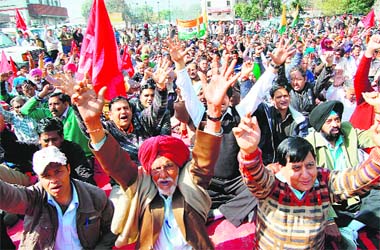 UP IN ARMS: Railway workers stage a protest outside the Amritsar Raiway Station