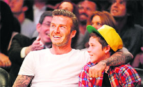 David Beckham and son Brooklyn watch the NBA game between Lakers and Miami Heat at the Staples Center in Los Angeles on Sunday