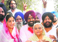 SAD candidate from Jalandhar Cantt Pargat Singh with his mother, wife and supporters after his victory in Jalandhar