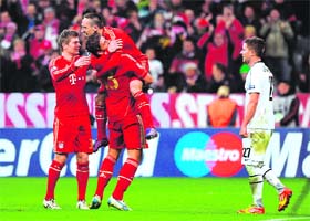 Bayern Munich players celebrate after beating Fc Basel 7-0 in Munich on Tuesday