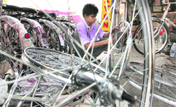 A worker fixes the spokes of a bicycle in Ludhiana. The cycle industry expects a fresh lease of life post-Budget.