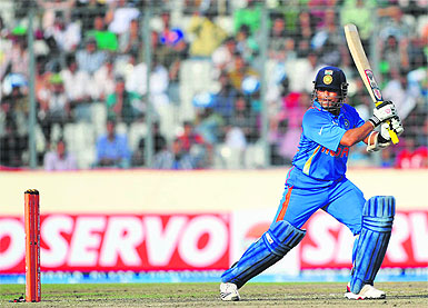 Sachin Tendulkar plays a shot during the Asia Cup ODI against Bangladesh at the Sher-e-Bangla Stadium in Dhaka on Friday. Tendulkar,with 114 off 147 balls, became the first batsman in the history of cricket to score 100 international centuries, adding another milestone in his record-breaking career