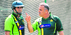Pakistan's coach Dav Whatmore (R) talks to Nasir Jamshed during a training session at the Sher-e-Bangla Stadium in Dhaka on Saturday.