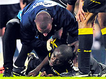 Bolton Wanderer's Fabrice Muamba is treated by medical staff after collapsing during the FA Cup quarter-final match against Tottenham Hotspur in London on Saturday. Muamba was taken to the hospital and the game was abandoned