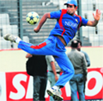 Bangladesh�s Mohammad Mahmudullah plays with a football during a training session in Dhaka on Monday. Bangladesh will be looking to beat Sri Lanka to ensure that they go into the final ahead of India.