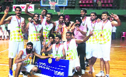 The Punjab baskteball team celebrate after winning the Fed Cup title in Kochi.