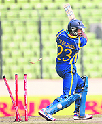 Sri Lanka's Tillakaratne Dilshan is bowled by Bangladesh's Nazmul Hossain during their Asia Cup match in Dhaka on Tuesday. Batting first, Sri Lanka were all out for 232. 