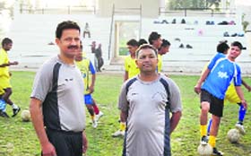Dr Jitender Kumar (L) and Kulwant Singh at the YFC training ground in Rurka Kalan