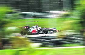 McLaren-Mercedes� Lewis Hamilton powers his car during the quailfying session of Formula One's Malaysian Grand Prix at the Sepang International Circuit on Saturday