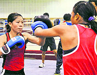 Five-time world champion MC Mary Kom (left) defeated current world champion and Asian Games gold medallist Ren Cancan of China 14/8 in the 51kg category