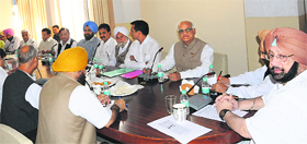 Capt Amarinder Singh addresses a meeting of District Congress Committee chiefs at the Congress Bhawan in Chandigarh on Monday.