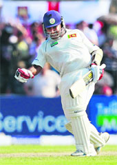 Mahela Jayawardene celebrates his century against England in Galle on Sunday. 