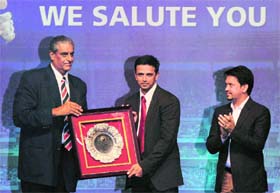 Rahul Dravid (R) is honoured by BCCI secretary Sanjay Jagdale in Mumbai on Tuesday